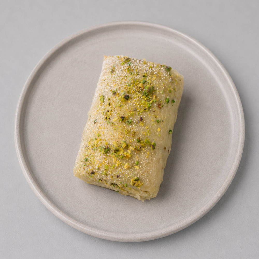 Mini brazo de gitano de pistacho con cobertura y virutas de pistacho elaborado en Tarragona