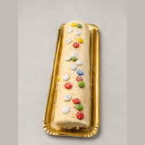 Brazo de gitano de chocolate blanco con cobertura de chocolate blanco y almendra crocanti en Tarragona