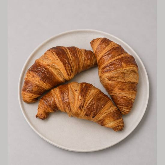 Croissant París artesanal de mantequilla recién horneado tuobrador