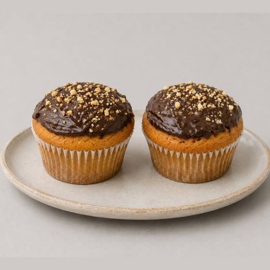 Madalena artesanal rellena de chocolate y almendra crocanti en Tarragona