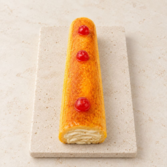 Brazo de crema pastelera sobre piedra clara | Tu Obrador Tarragona