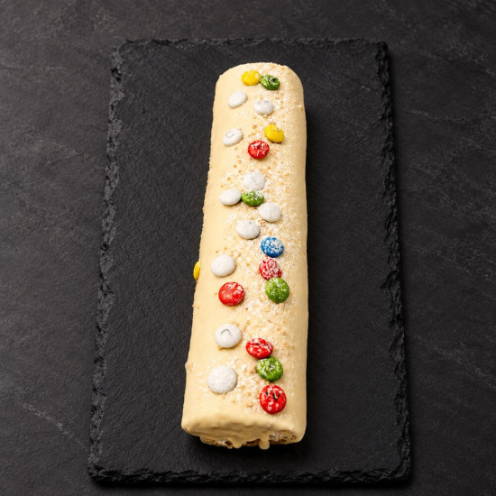 Brazo de chocolate blanco sobre pizarra | Tu Obrador Tarragona